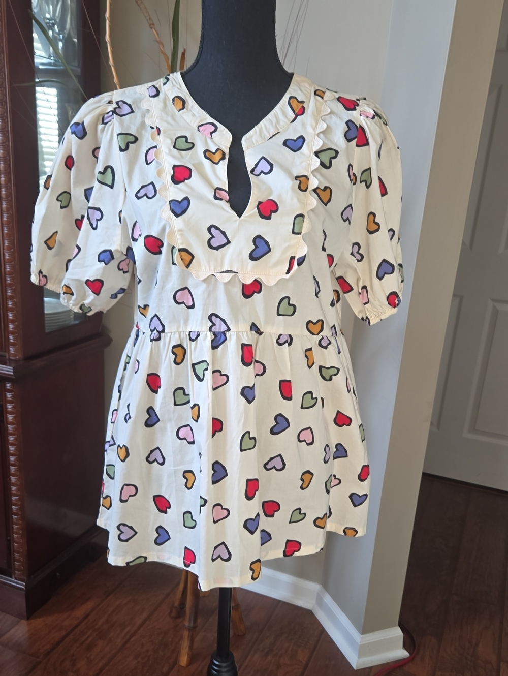 Umgee White Peplum Tunic with Multicolor Heart Print